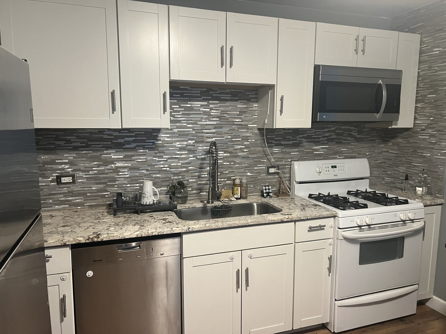 3200 Thrush Lane Rolling Meadows, IL 60008 - Photo 2 of 9 a kitchen with stainless steel appliances granite countertop a sink stove and microwave