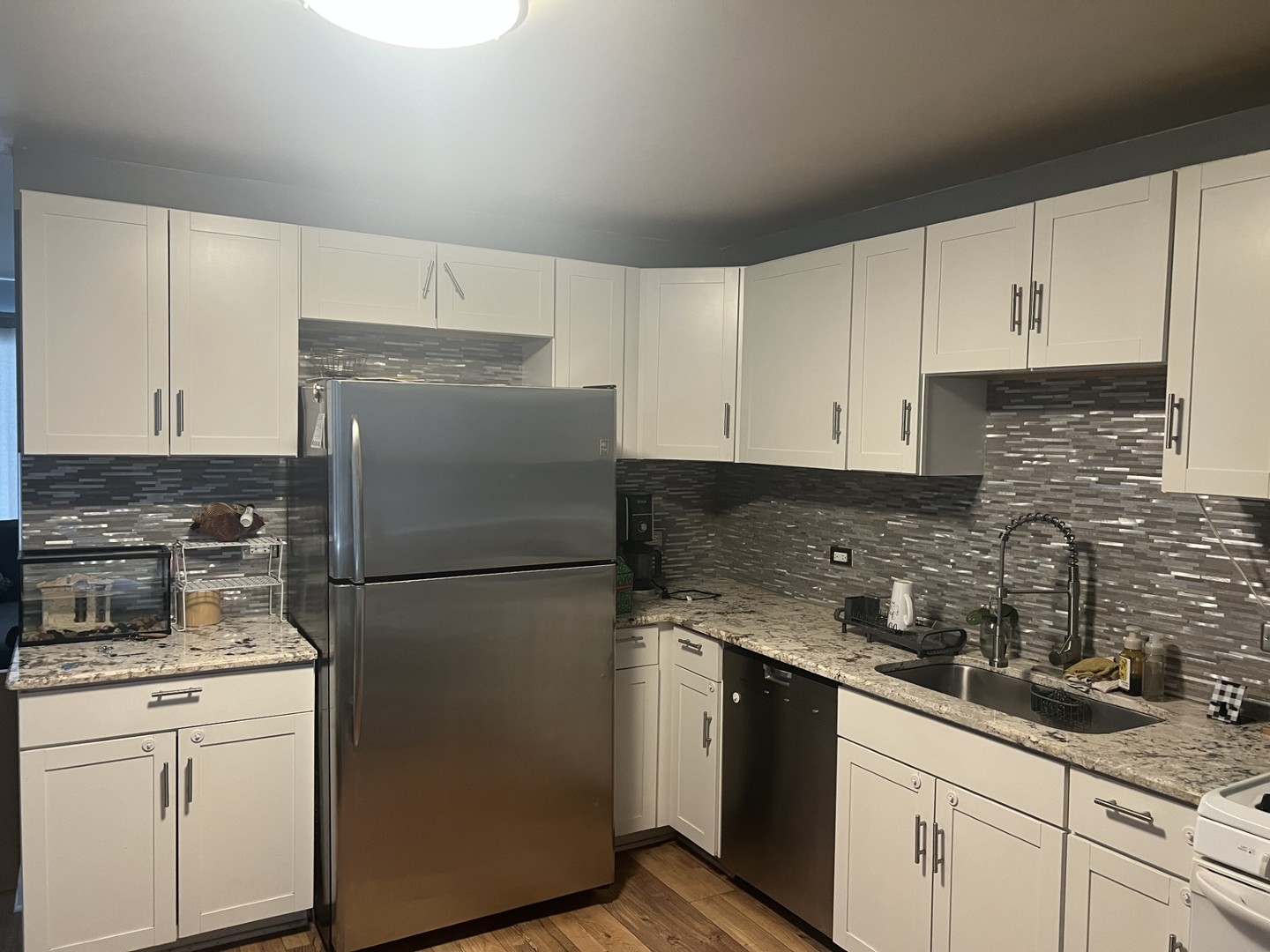 3200 Thrush Lane Rolling Meadows, IL 60008 - Photo 3 of 9 a kitchen with a refrigerator sink and cabinets