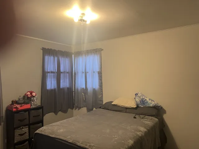 a bedroom with a bed and a cabinets