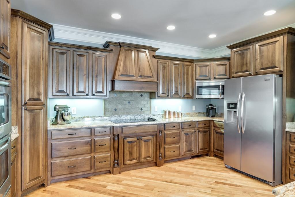 4121 Franklin Road Lebanon, TN 37090 - Photo 11 of 26 a kitchen with stainless steel appliances granite countertop a refrigerator and a stove top oven