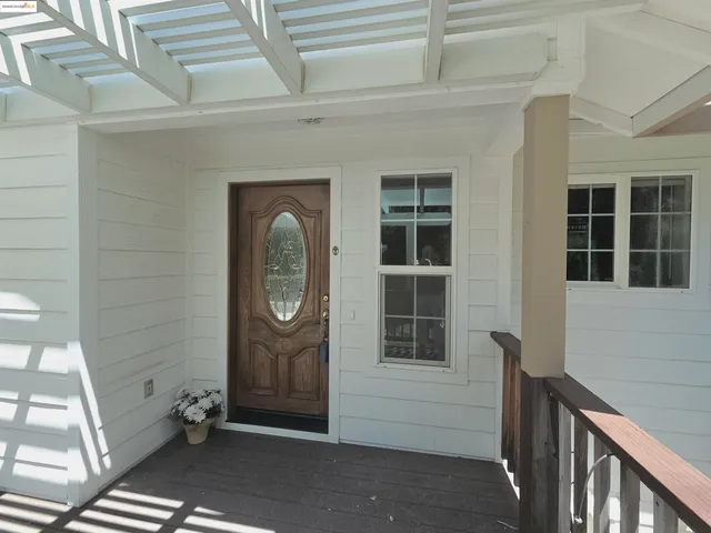 a kitchen with a stove a sink dishwasher and a refrigerator