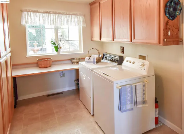 a view of swimming pool with outdoor seating and plants