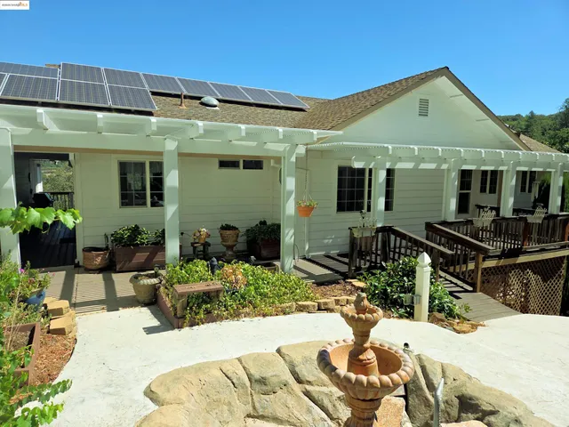 a view of balcony with wooden floor and fence