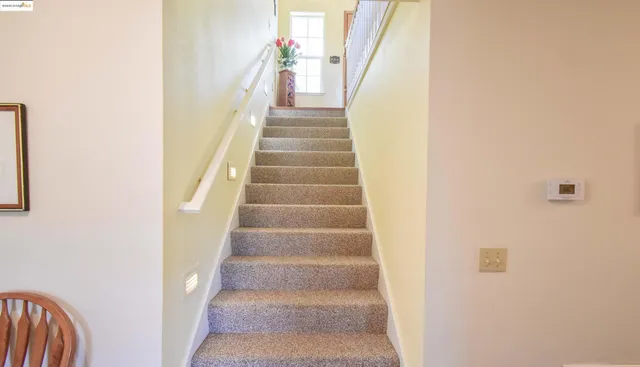 a bedroom with furniture a bed and a chandelier
