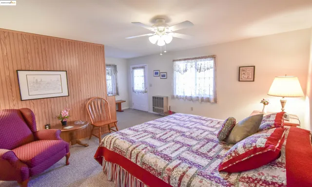 a bedroom with a bed and a table