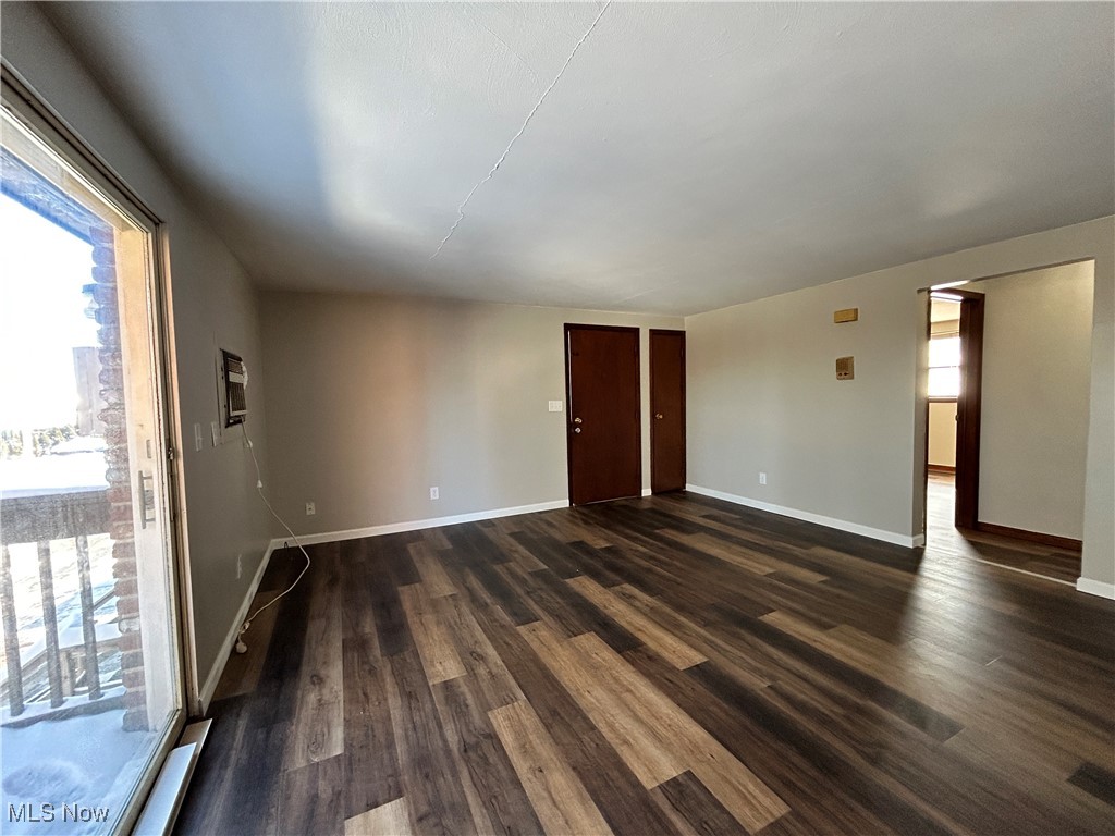 98 View Street, Unit 2 Weirton, WV 26062 - Photo 3 of 10 Unfurnished room featuring plenty of natural light and dark wood finished floors