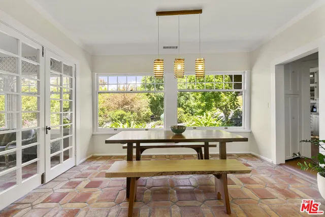 a white cabinet with a potted plant on it