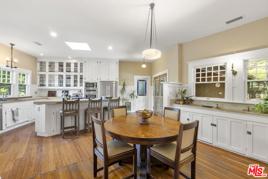 15454 South Mountain Road Santa Paula, CA 93060 - Photo 17 of 65 a view of a dining room and livingroom with furniture wooden floor a chandelier