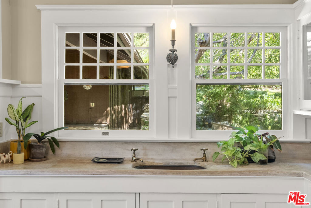 15454 South Mountain Road Santa Paula, CA 93060 - Photo 20 of 65 a white cabinet with a potted plant on it