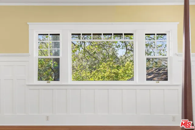 a bedroom with a bed and a table