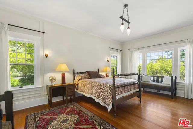 a view of backyard of house with outdoor seating