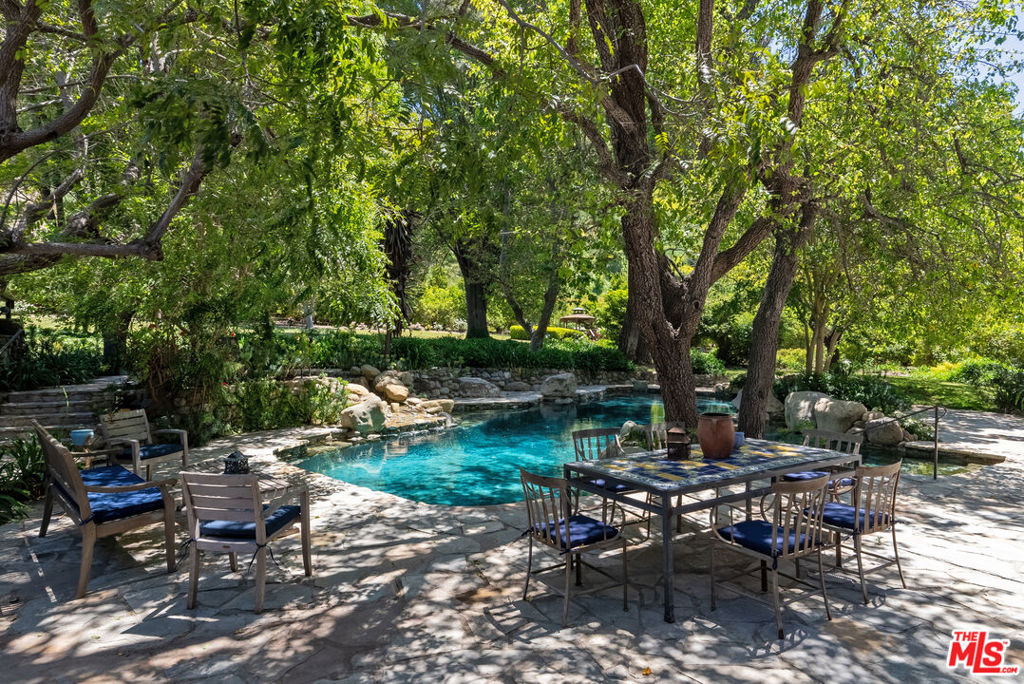 15454 South Mountain Road Santa Paula, CA 93060 - Photo 37 of 65 a view of a table and chairs in a patio