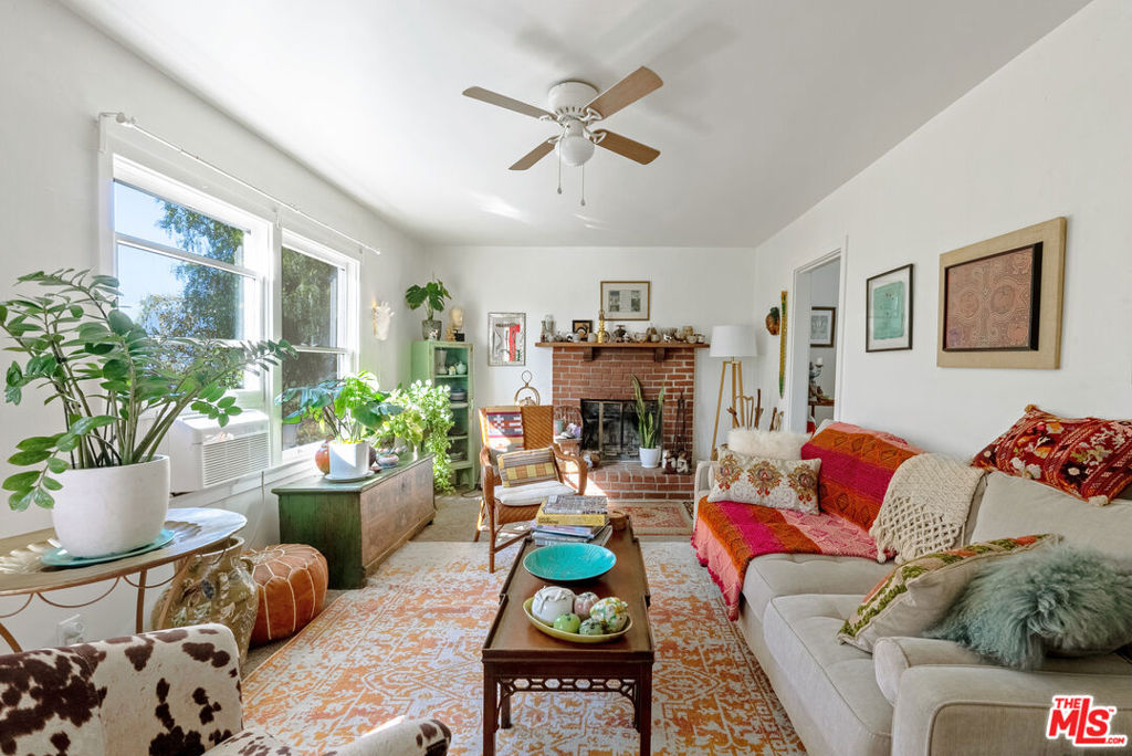 15454 South Mountain Road Santa Paula, CA 93060 - Photo 55 of 65 a living room with furniture fireplace and a potted plant