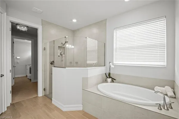 a bathroom with a bathtub and a sink