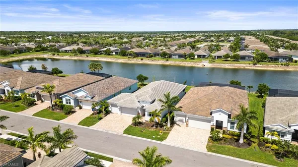 an aerial view of a house with a lake view