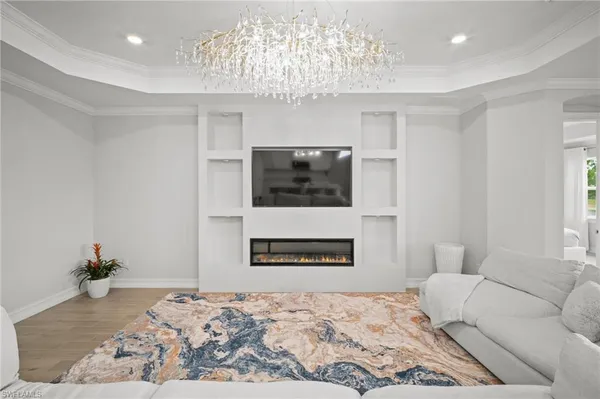 a bedroom with a bed and a television