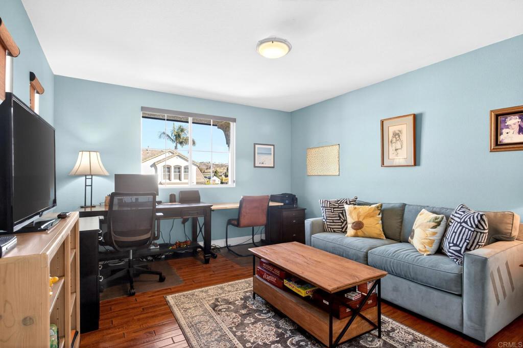 5531 Foxtail Loop Carlsbad, CA 92010 - Photo 41 of 62 a living room with furniture rug and window