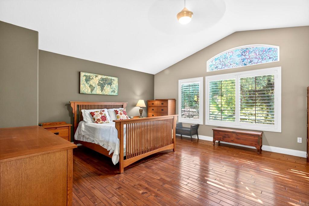 5531 Foxtail Loop Carlsbad, CA 92010 - Photo 49 of 62 a bedroom with bed and window