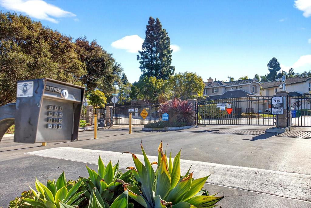 5531 Foxtail Loop Carlsbad, CA 92010 - Photo 5 of 62 a front view of a house with a yard and garage