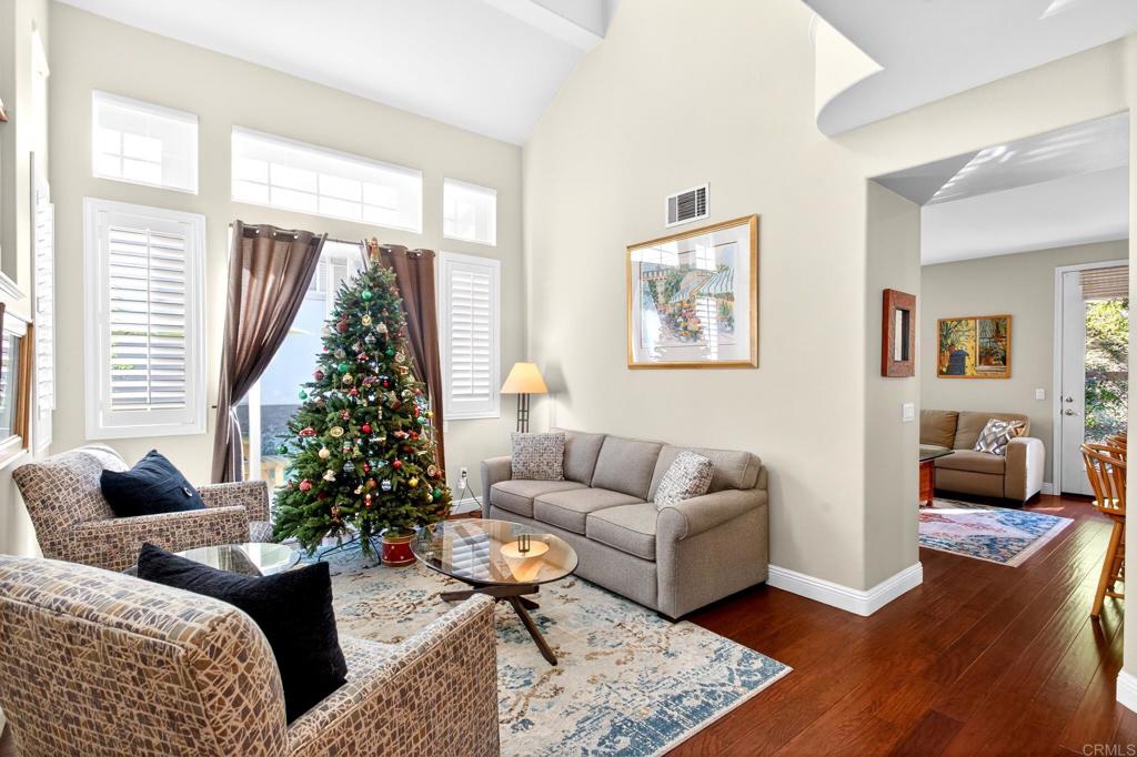 5531 Foxtail Loop Carlsbad, CA 92010 - Photo 9 of 62 a living room with furniture and a potted plant