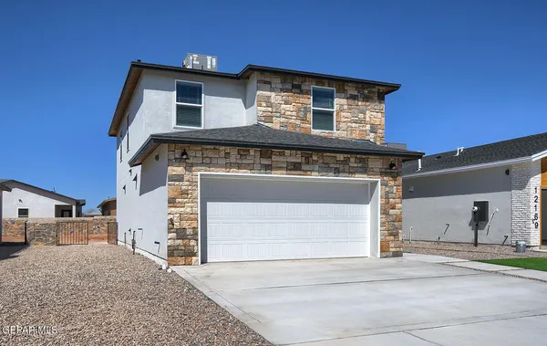 a front view of a house with a garage