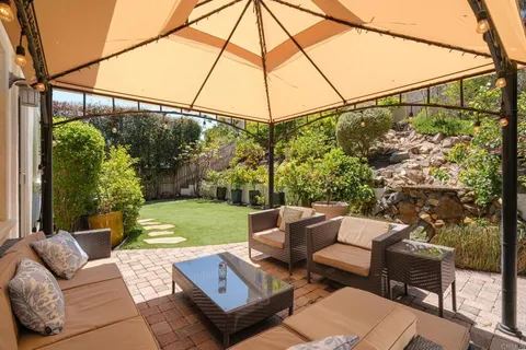 a view of backyard with furniture and garden