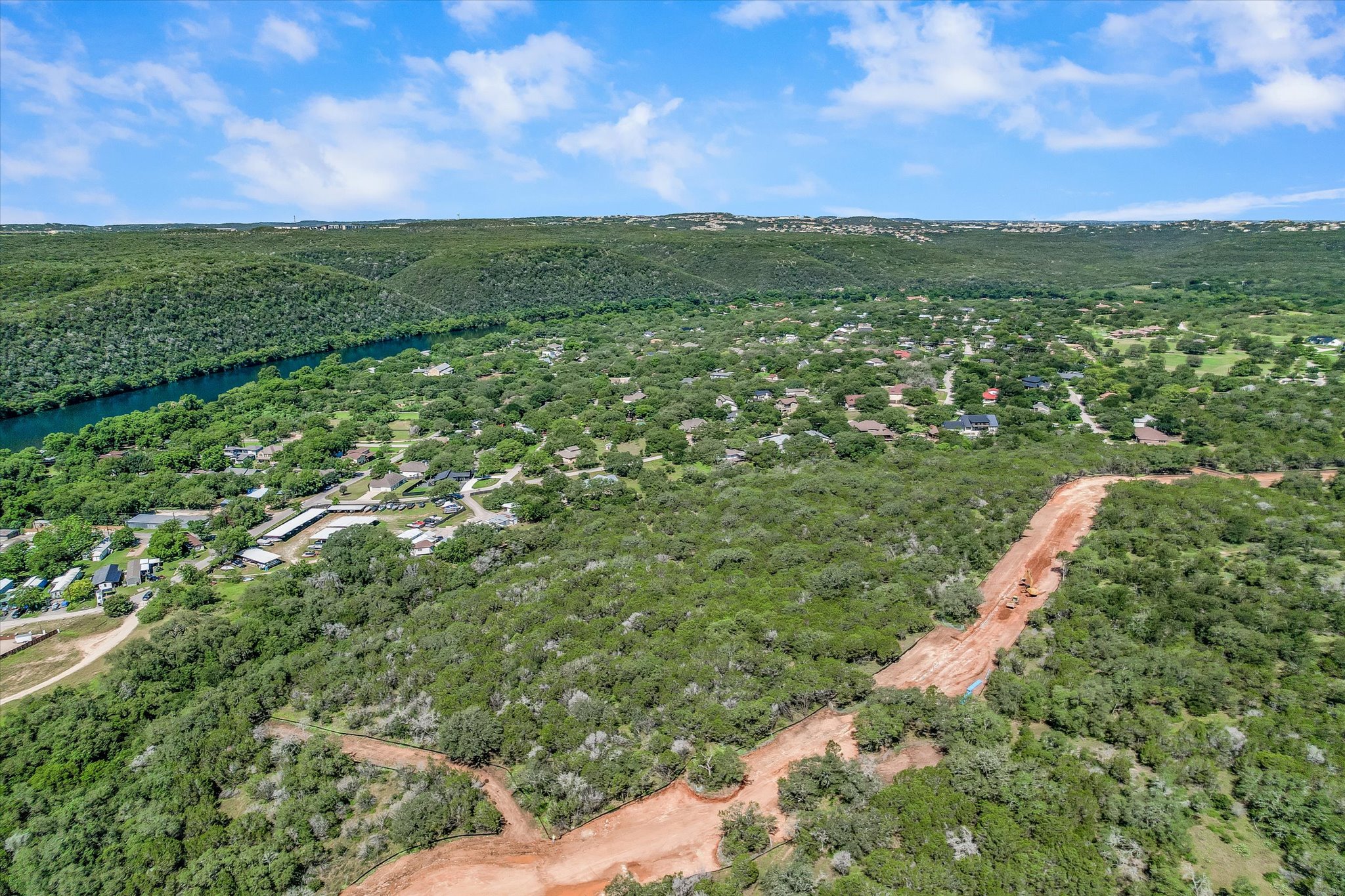 900 North Quinlan Park Road Austin, TX 78732 - Photo 7 of 10 a view of a city with lush green forest