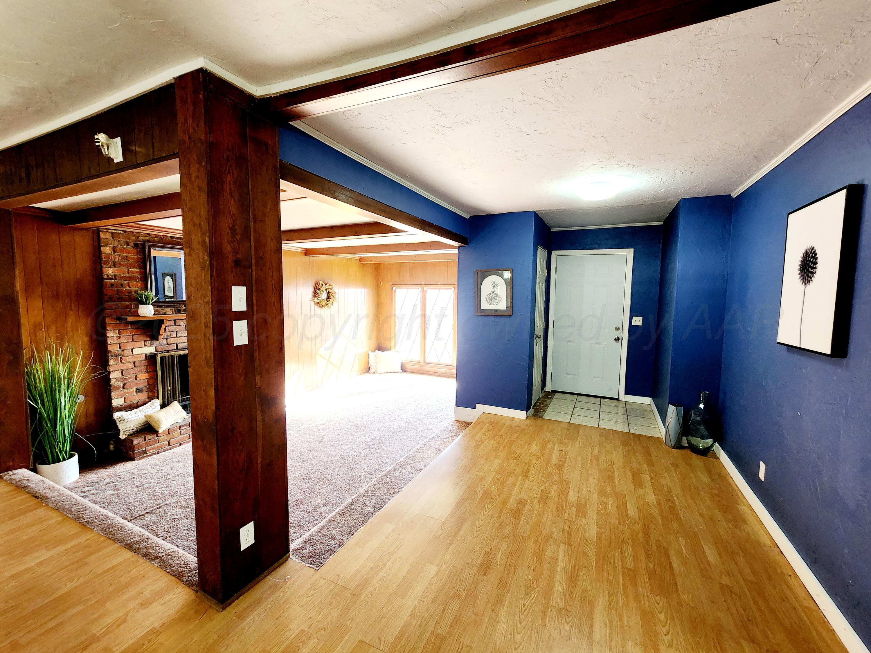 3320 Lynette Drive Amarillo, TX 79109 - Photo 3 of 19 a view of hallway with livingroom and wooden floor