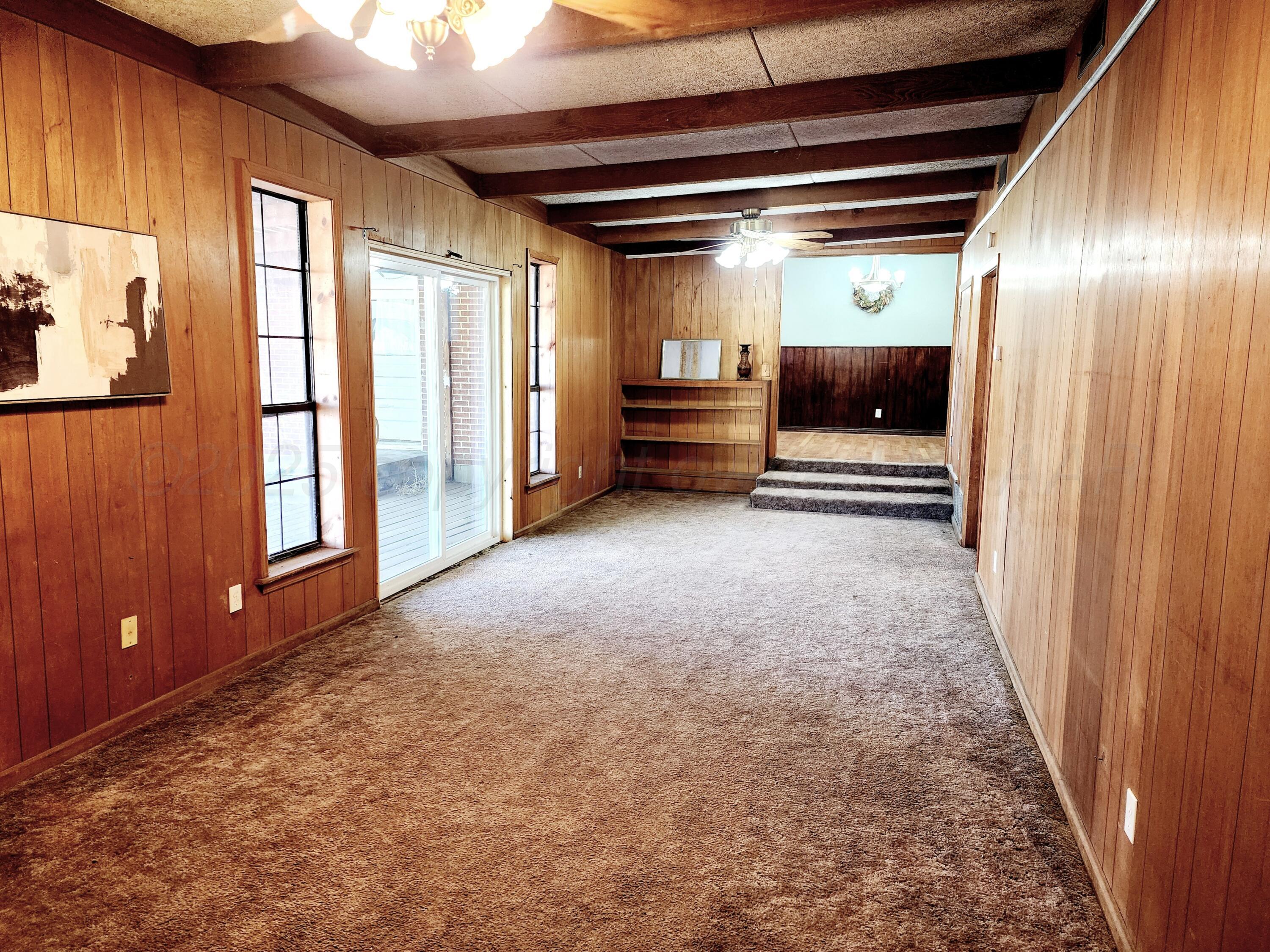 3320 Lynette Drive Amarillo, TX 79109 - Photo 9 of 19 a view of empty room with wooden floor