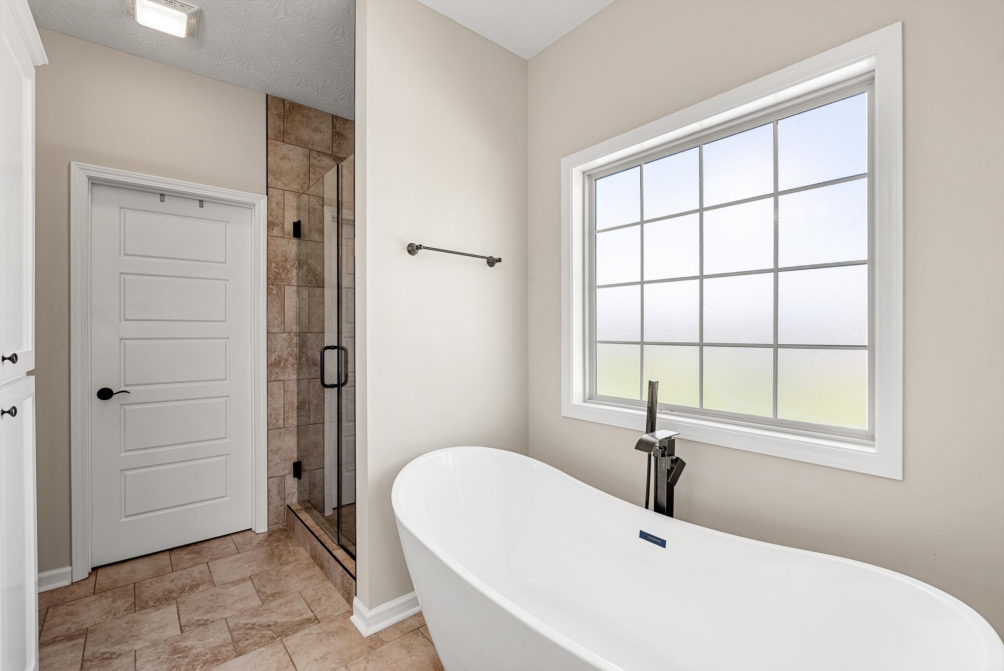 57 Cheney Lane Lafayette, TN 37083 - Photo 18 of 35 a white bath tub sitting next to a window