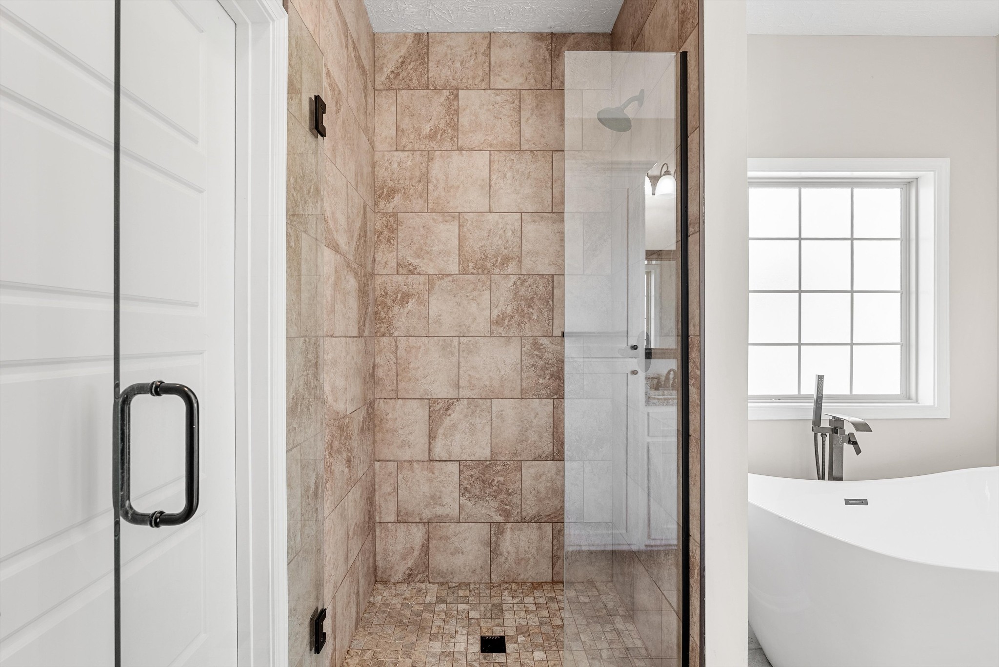57 Cheney Lane Lafayette, TN 37083 - Photo 19 of 35 a bathroom with a shower a sink and a window