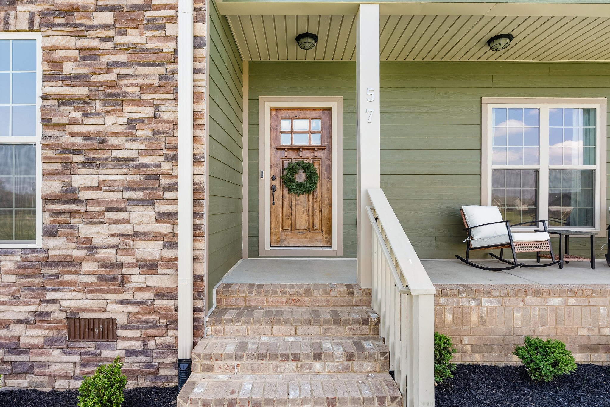 57 Cheney Lane Lafayette, TN 37083 - Photo 2 of 35 a front view of a house with a glass door