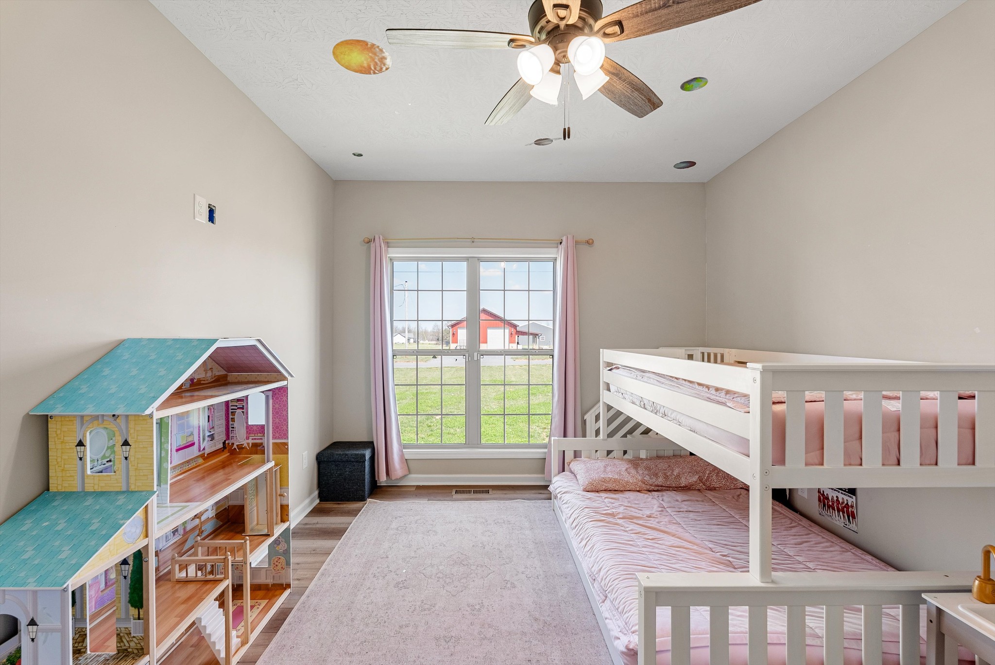 57 Cheney Lane Lafayette, TN 37083 - Photo 21 of 35 a living room with a baby crib furniture a chandelier and a bookshelf