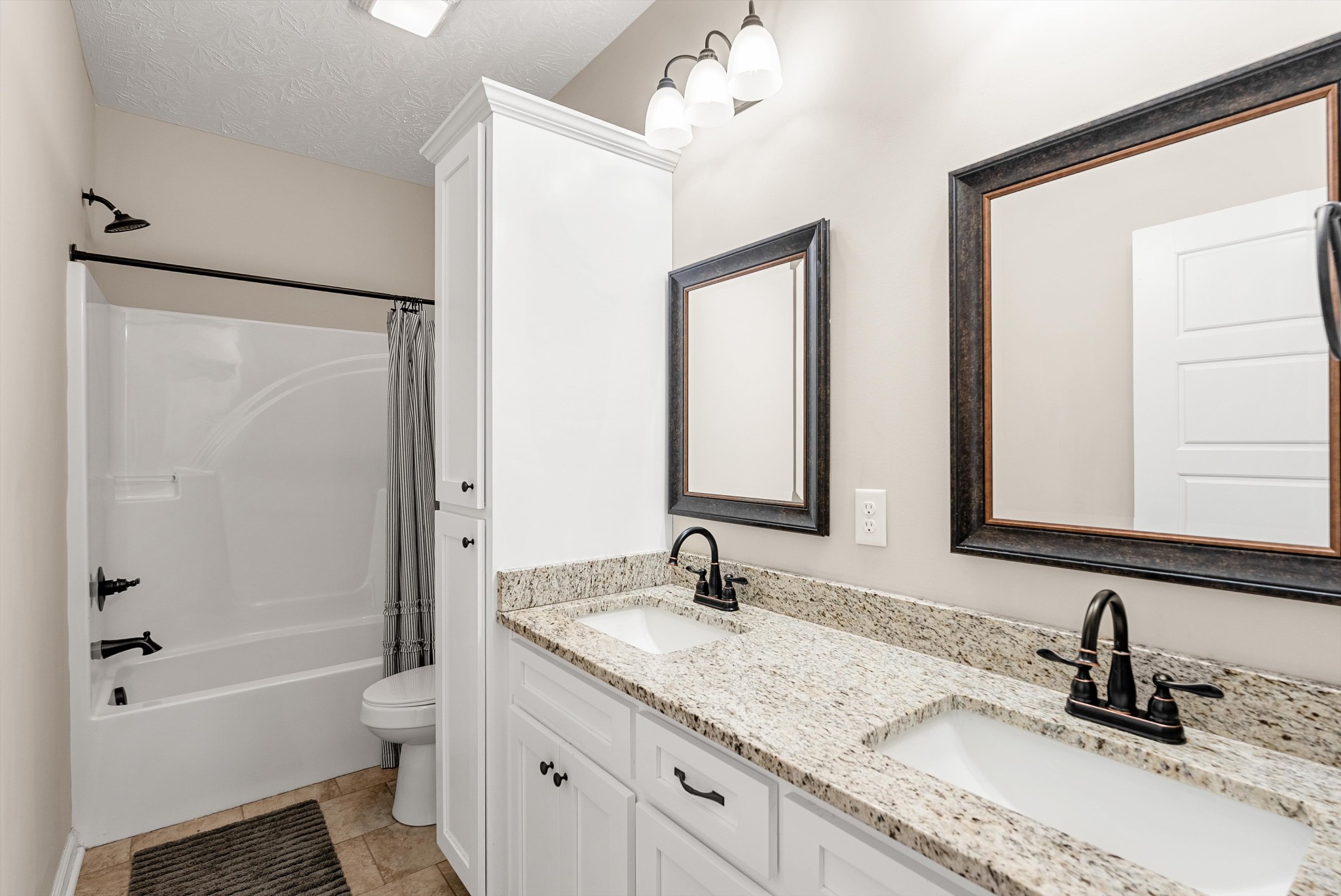 57 Cheney Lane Lafayette, TN 37083 - Photo 23 of 35 a bathroom with a granite countertop sink toilet and shower