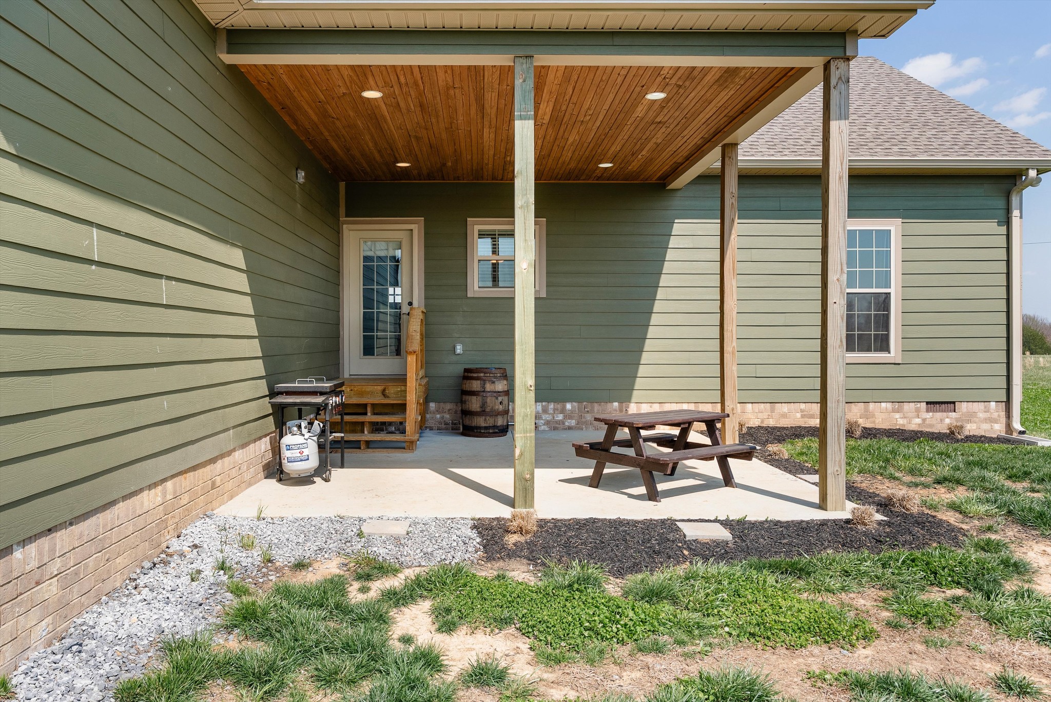 57 Cheney Lane Lafayette, TN 37083 - Photo 24 of 35 a view of a patio with table and chairs and wooden fence