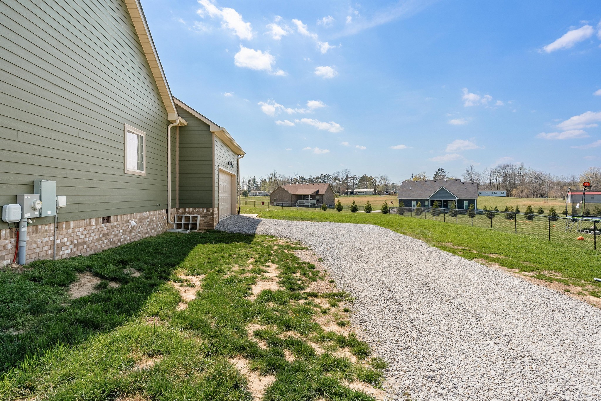 57 Cheney Lane Lafayette, TN 37083 - Photo 27 of 35 a view of a house with a yard and potted plants