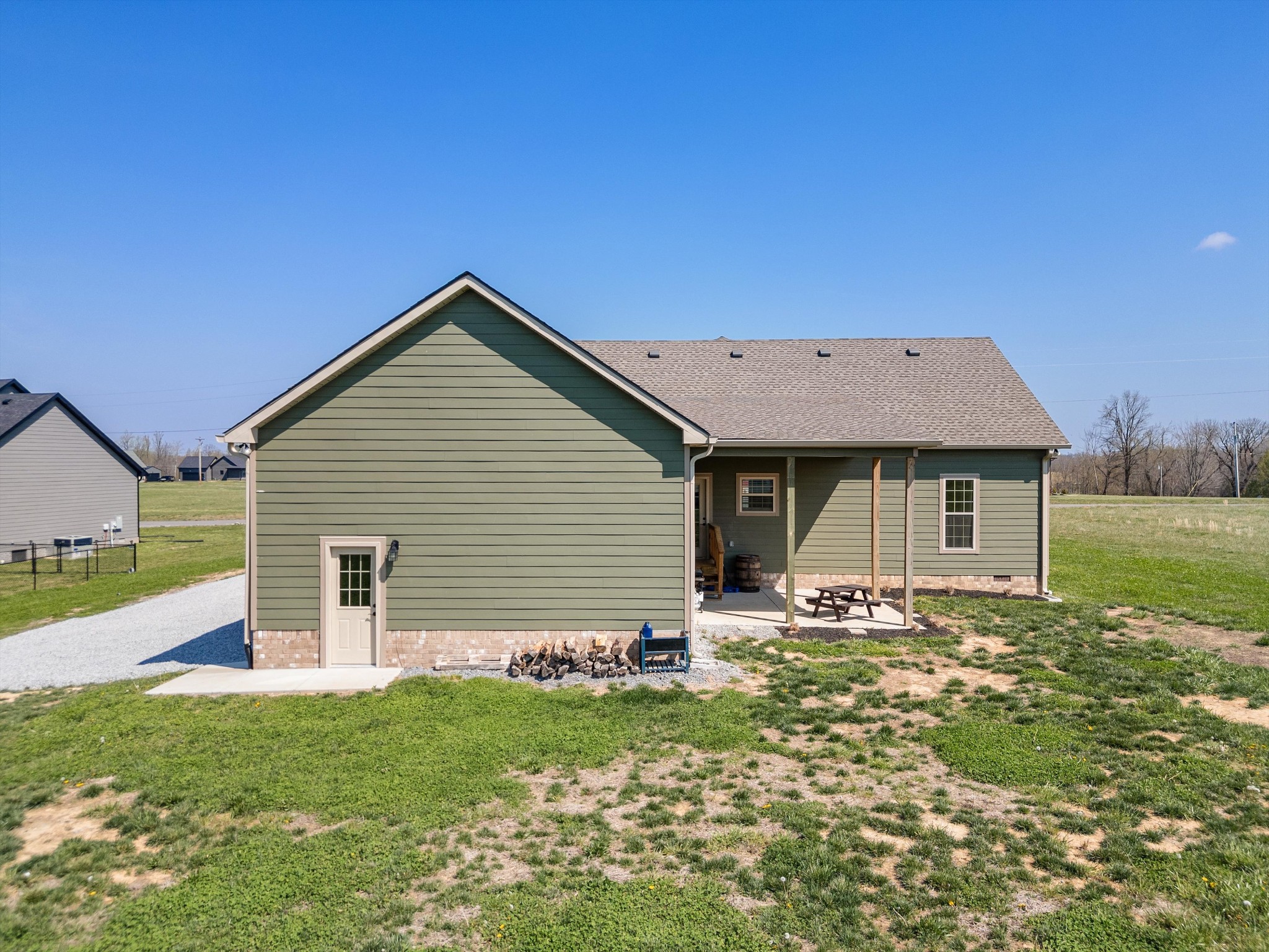 57 Cheney Lane Lafayette, TN 37083 - Photo 30 of 35 a backyard of a house with table and chairs