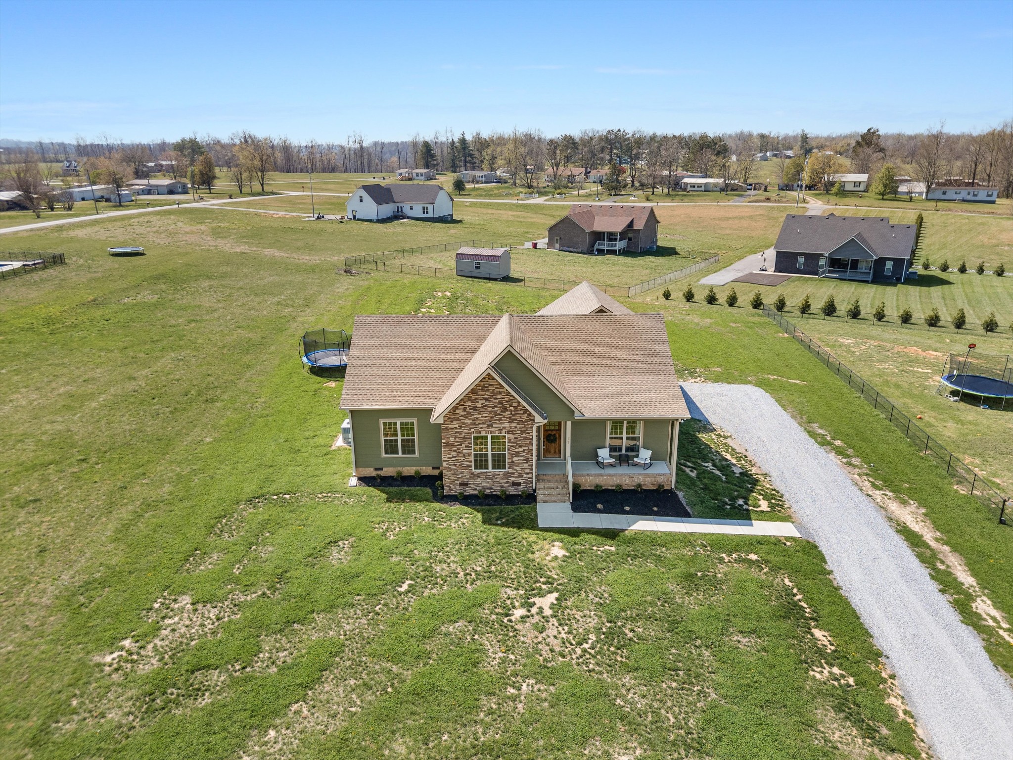57 Cheney Lane Lafayette, TN 37083 - Photo 33 of 35 an aerial view of a house with a garden and lake view