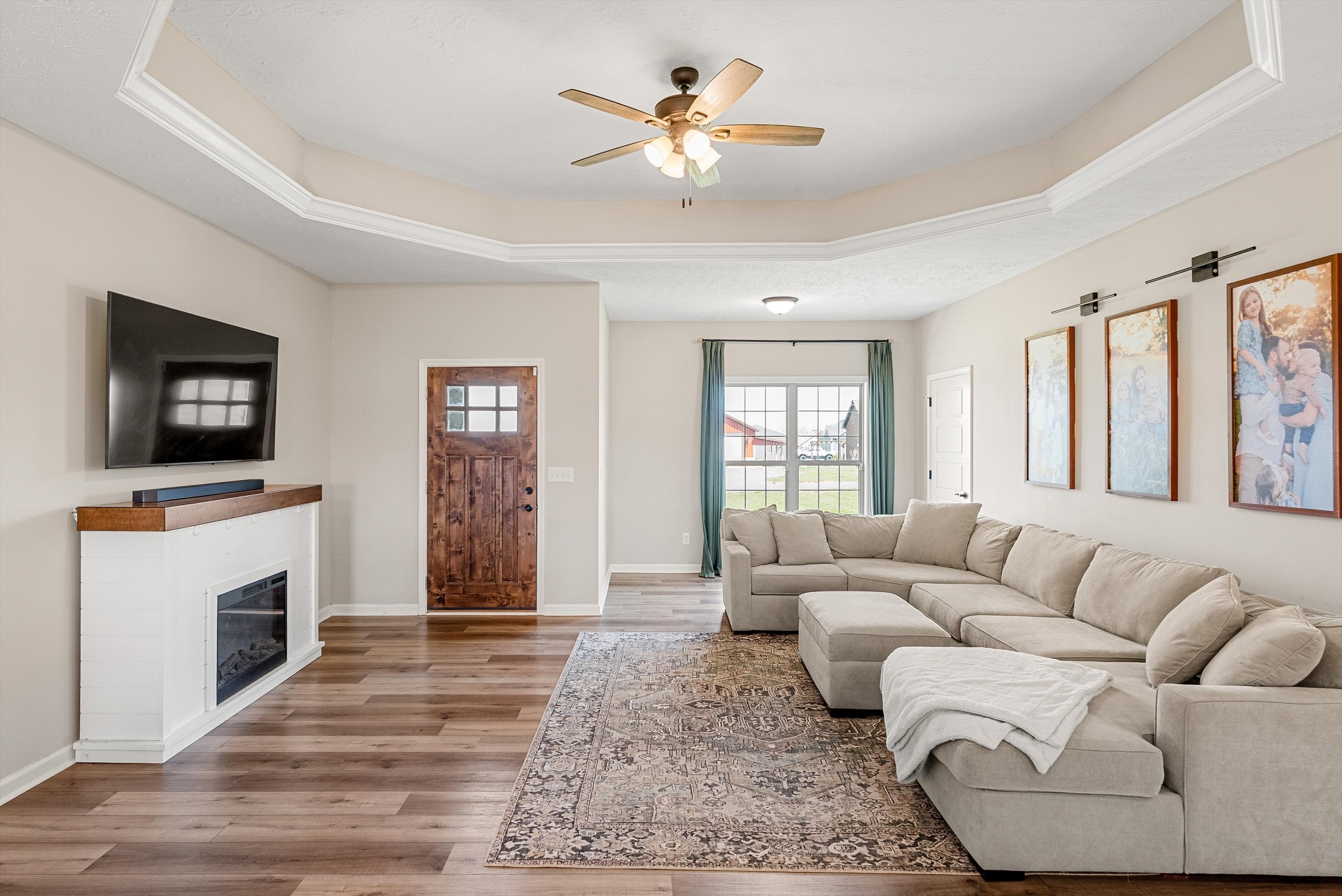 57 Cheney Lane Lafayette, TN 37083 - Photo 4 of 35 a living room with furniture ceiling fan and a fireplace