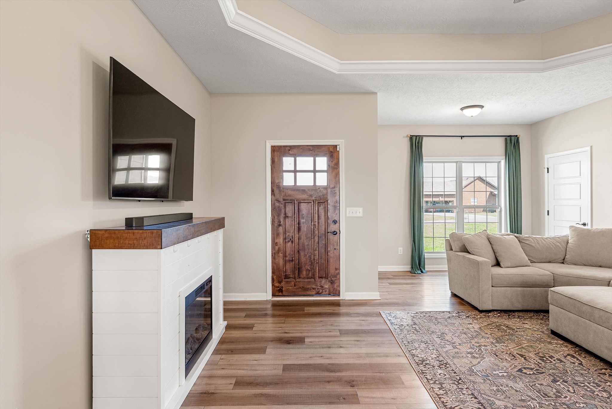 57 Cheney Lane Lafayette, TN 37083 - Photo 6 of 35 a living room with furniture and a flat screen tv