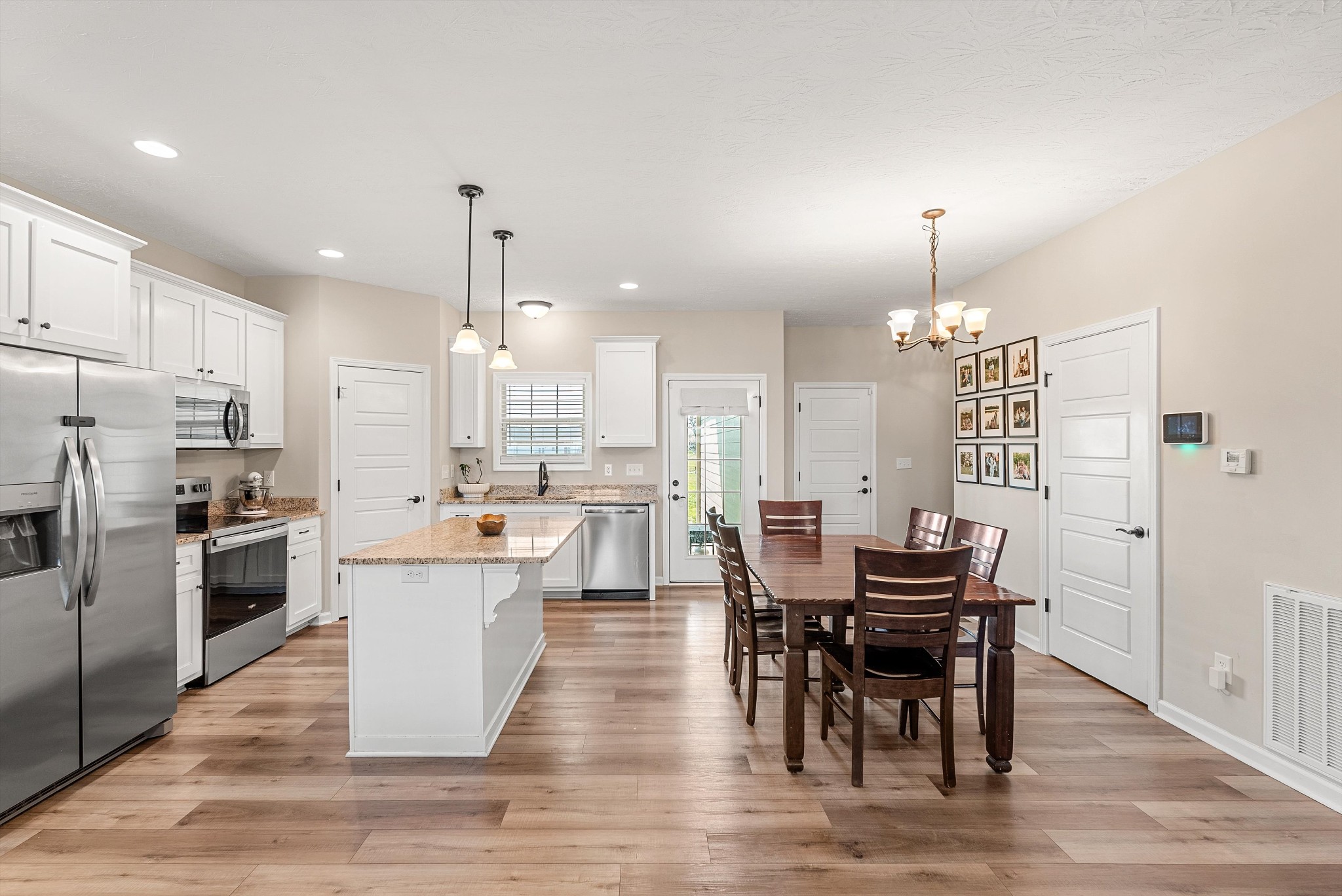 57 Cheney Lane Lafayette, TN 37083 - Photo 7 of 35 a large kitchen with a table and chairs