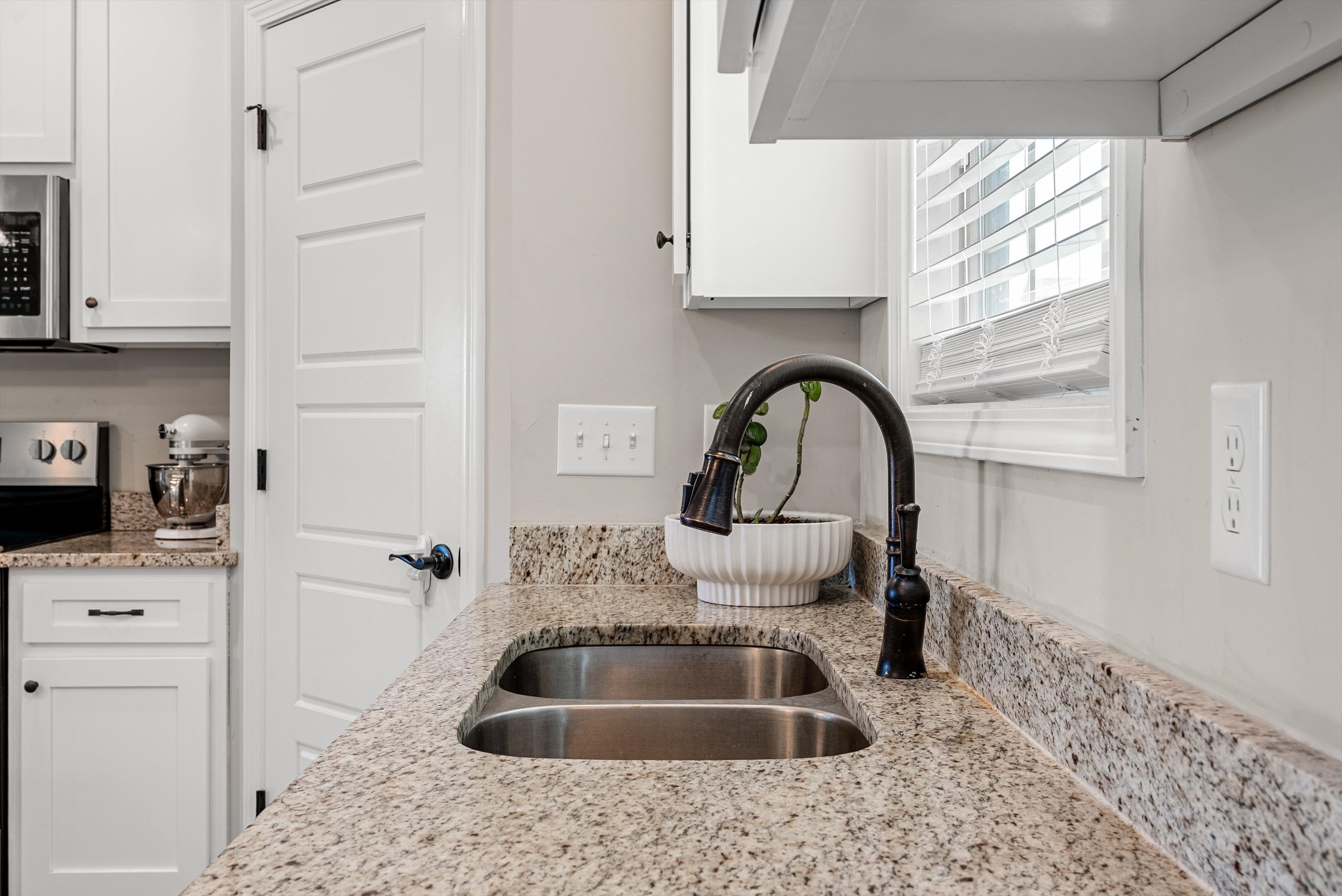 57 Cheney Lane Lafayette, TN 37083 - Photo 10 of 35 a kitchen with a sink cabinets and a window