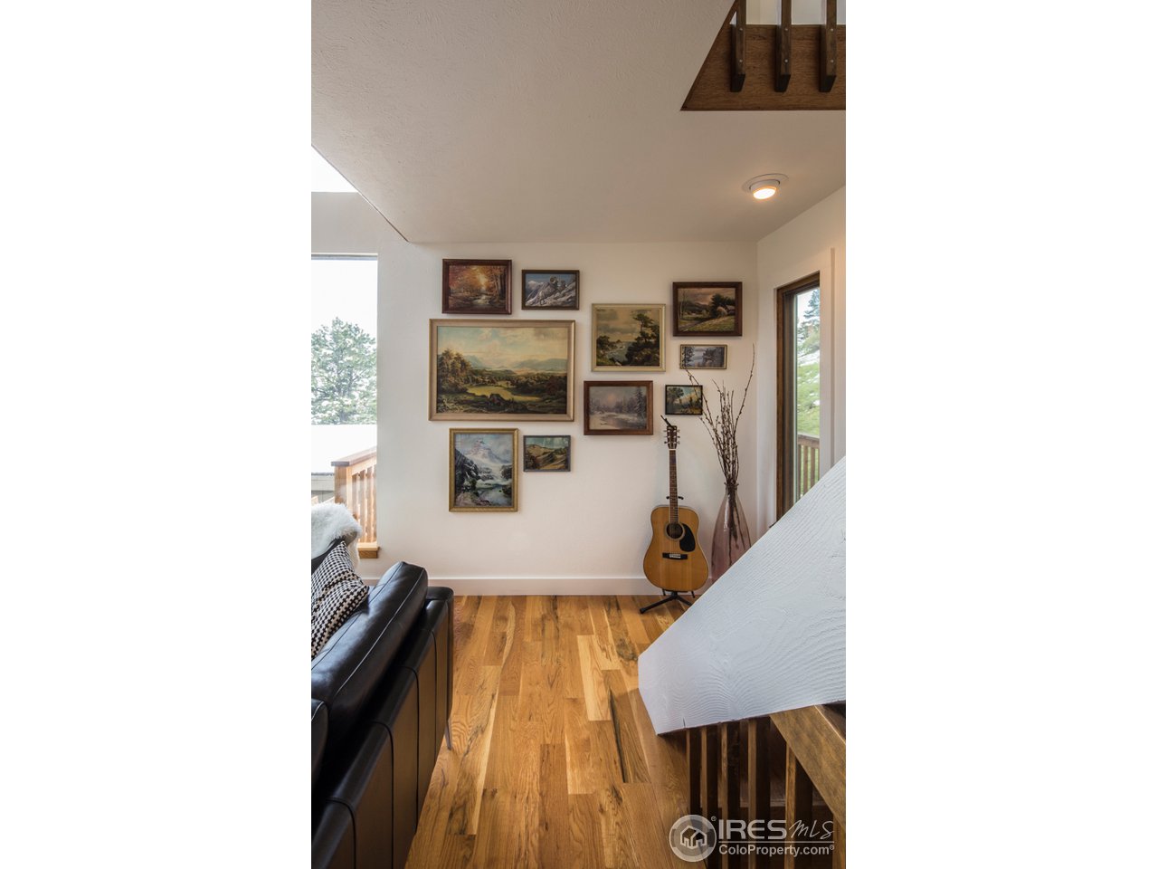 6438 Red Hill Road Boulder, CO 80302 - Photo 11 of 16 a living room with furniture and wooden floor