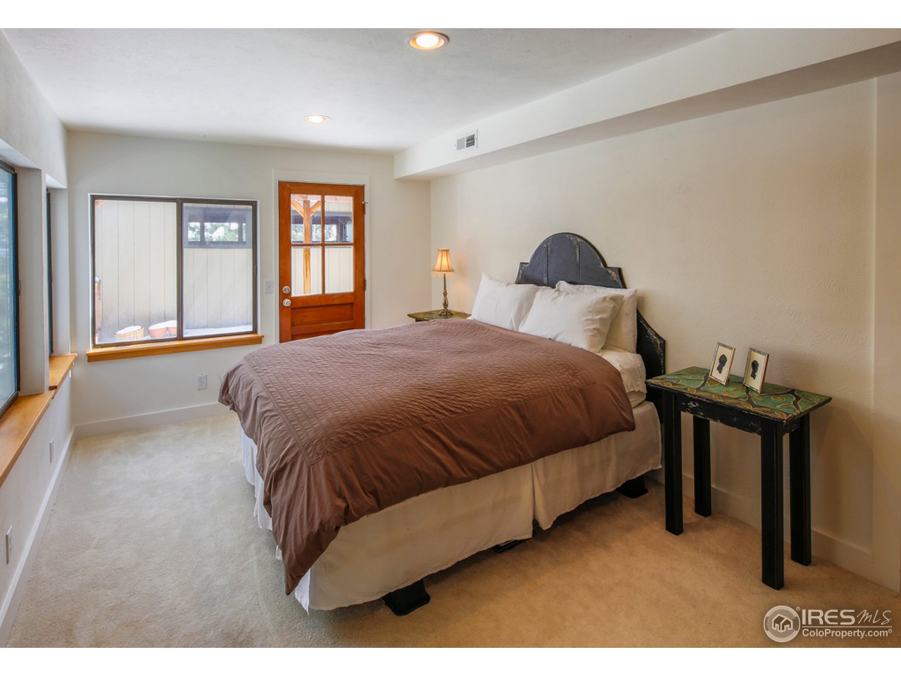 6438 Red Hill Road Boulder, CO 80302 - Photo 13 of 16 a bedroom with a bed and window