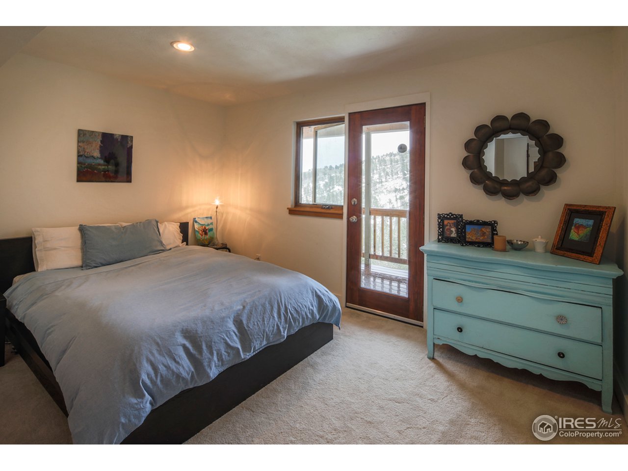6438 Red Hill Road Boulder, CO 80302 - Photo 14 of 16 a bedroom with a large bed and a dresser