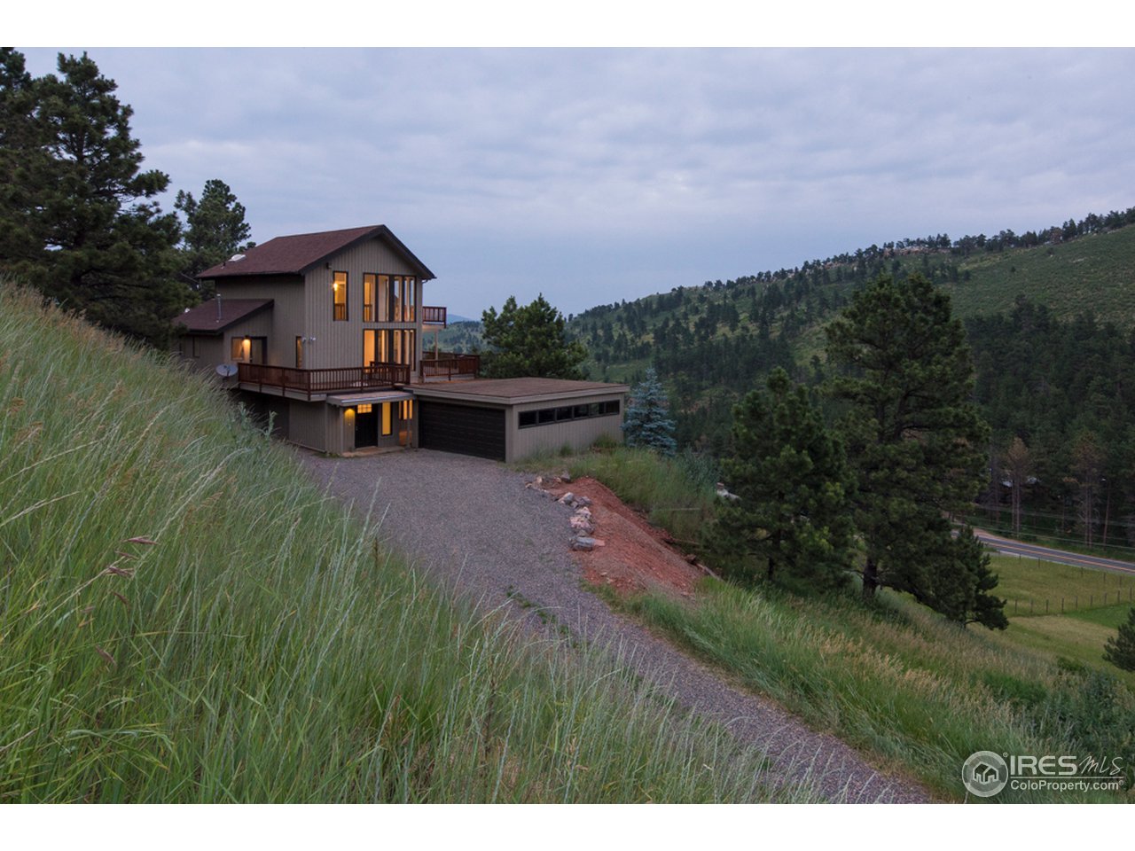 6438 Red Hill Road Boulder, CO 80302 - Photo 2 of 16 a front view of a house with garden