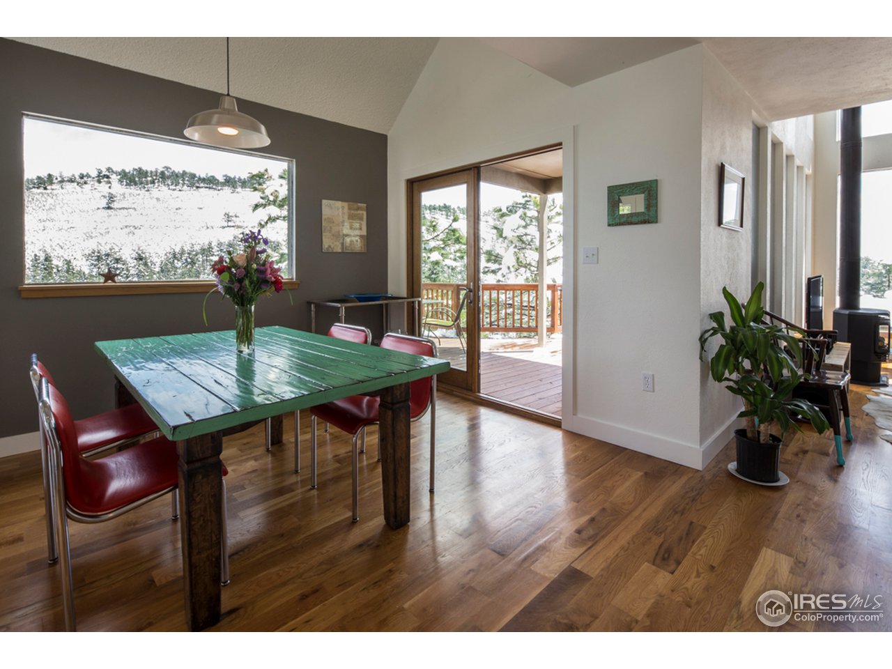 6438 Red Hill Road Boulder, CO 80302 - Photo 4 of 16 a view of a dining room with furniture window and wooden floor