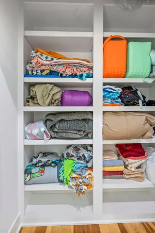 a bathroom with a tub shower and sink