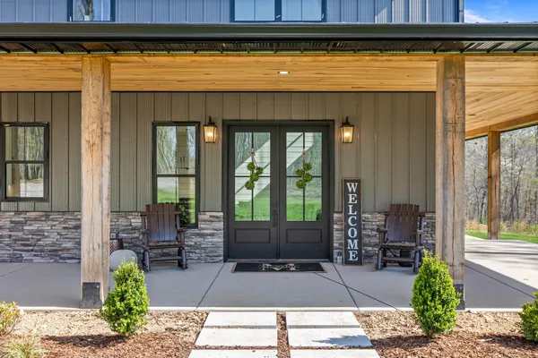 a kitchen with stainless steel appliances kitchen island granite countertop a stove a sink and a refrigerator