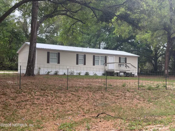 a house view with a backyard space